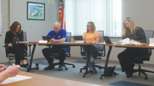 The Paxton-Buckley-Loda school district’s assistant superintendent, Tara Chandler, far-left, and school board members, from left, Jason Rust, Brittney Gehrt and Dawn Bachtold look on during the board’s monthly meeting on Wednesday, June 11, in the board room at the unit office in Paxton. Daniel L. Chamness/Ford County Chronicle