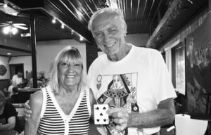 ABOVE: The Gibson City Restoration Association’s vice president, Denis Fisher, poses with Phyllis Hitchcock during the association’s weekly Queen of Hearts drawing on Wednesday, July 23, after her ticket was pulled from the tumbler and she chose to see what was under Card No. 50 on the playing board, revealing the 5 of Spades. She won $50 for having her ticket drawn. Because the Queen of Hearts was not revealed, the $25,486 jackpot carried over to the next drawing, which will be at 7 p.m. Wednesday, July 30, at Mark’s on First, 120 E. 1st St., Gibson City. The weekly Queen of Hearts drawings raise funds for the restoration of the historic Burwelll Building downtown. Tickets can be purchased through Venmo under “@GibsonCityQueenOfHearts” or at NAPA Auto Parts, Mark’s on First or The Fashion Shop in Gibson City.
